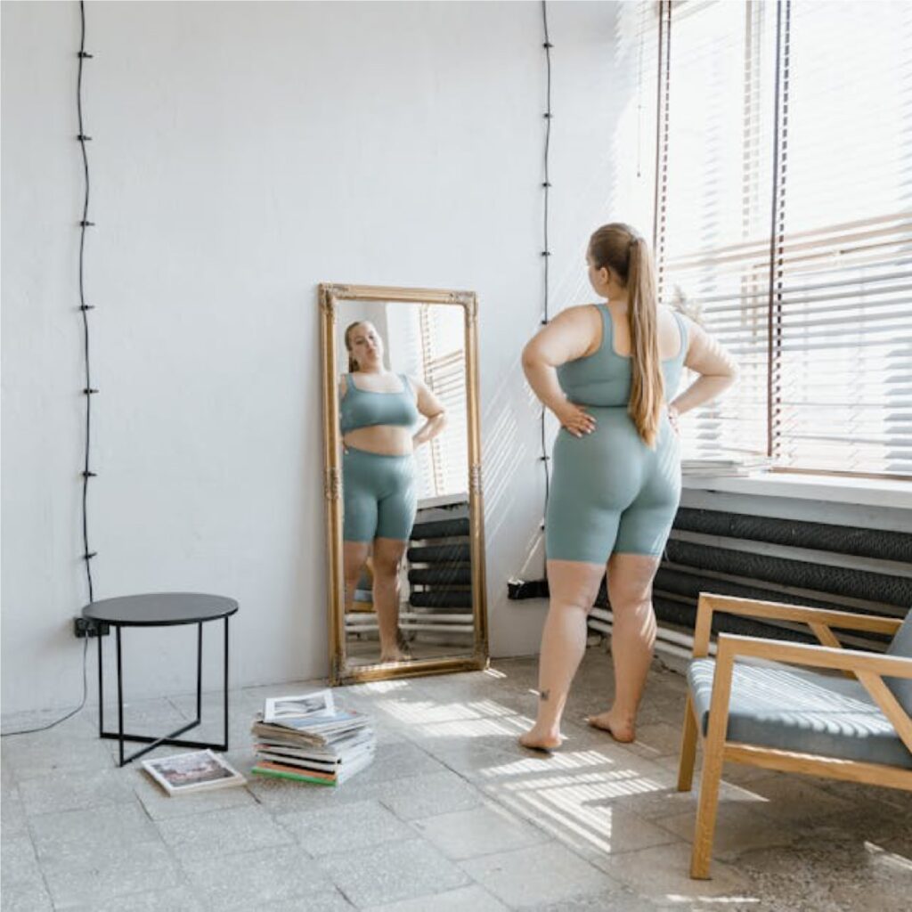 woman looking in mirror